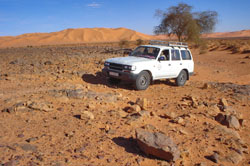 Toyota Landcruiser crossing the rocky Libyan desert