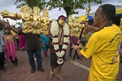 Thaipusam pilgrim carries gold-plated Kavadi