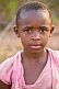 Image of Young Gabonese girl with short hair in a light purple shirt.