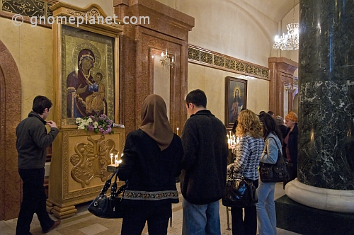 Eastern Orthodox worshippers pray before an icon in the Sameba Cathedral.