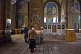 Image of Worshippers pray before the icons in the Eastern Orthodox cathedral.