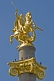 Image of The golden statue of St George killing the Dragon tops the column in Freedom Square.