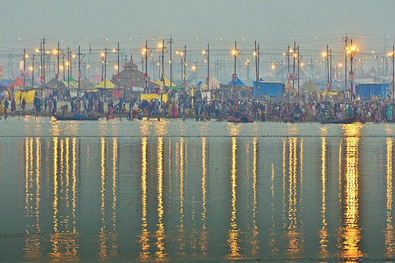 View across Ganges Yamuna river Sangam to the bathing ghats at dawn.