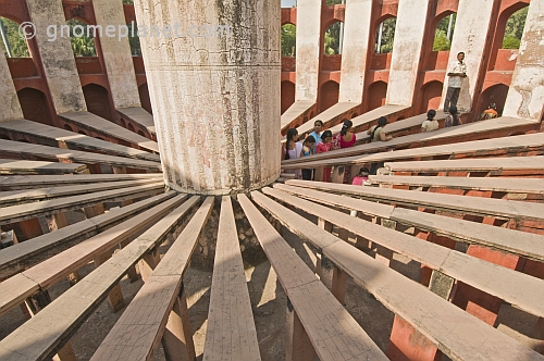 Visitors explore the Ram Yantra, used to measure horizontal and vertical angles of celestial bodies, at the Jantar Mantar observatory on Sansad Marg.