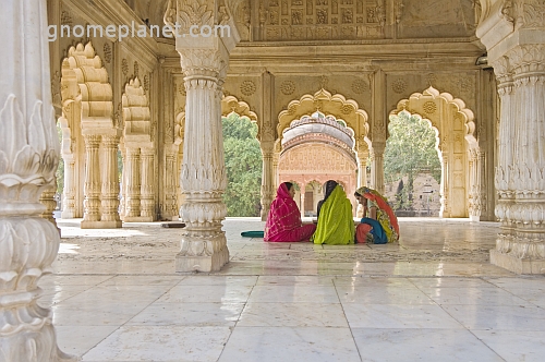 Three Indian ladies sit in the Cenotaph of Maharaja Bakhtawar Singh.