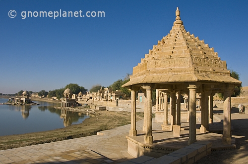 Carved sandstone temples along the edge of the Gadi Sagar built 1367 by Maharaja Gadsi Singh.