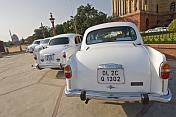 White Ambassador government cars waiting outside the Lutyens-designed North Block Secretariat.