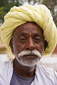 Rajsthani farmer in a light yellow turban.