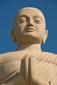 Bodhisattva statue next to the 20m tall statue of the Buddha.