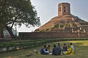 A group of students study in front of the 5thC Chaukhandi Stupa at Sarnath, which has an octagonal tower on top, built by Akbar in 1588.