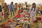 Trinket sellers display their wares to pilgrims under Lal Bahadur Shastri Bridge.