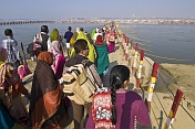 Indian Hindu pilgrims cross pontoon bridge over the River Ganges at the Kumbh Mela.