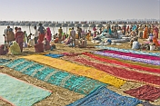 Colorful Saris Laid To Dry Next To Ganges River