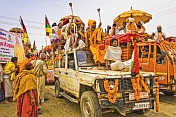 Highly decorated jeeps with Hindu Sadhus in Basant Panchami Snana procession.