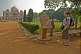 Young female Western tourist reads an account of the history of Humayun's Tomb.