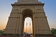 Sunset through 42m high Lutyens-designed India Gate war memorial.