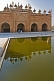 Image of The front of the Jama Masjid is relected in the ablutions pool.
