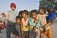 Image of Rajasthani street children jostle to get in front of the photographers lens.