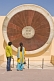 Image of An Indian couple examine the Narivalaya Dakshin Gola, one of the astronomical instruments at the Jantar Mantar Observatory.