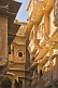 Image of Richly-carved sandstone balconies and window surrounds on a havelli in the old quarter.