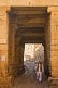 Image of An old man with a walking stick passes through one of the entrance gates to the fort.