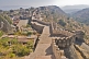 Image of The entrance gate and ramparts of the Kumbhalgarh Fort lead to a range of temples within the walls.