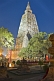 Twilight view of small stupas and shrines in front of the main Mahabodhi Temple.