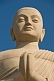 Image of Bodhisattva statue next to the 20m tall statue of the Buddha.