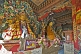 Image of Buddhist statues in colorful robes at the Bhutanese Temple.