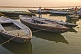 Image of Rowing boats for pilgrims on the Ganges River at sunset.