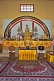 Image of Gold-robed Buddha statue on the altar of the Chinese Buddhist Monastery at Sarnath.