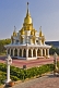 Buddhist Thai-style temple in white and gold.