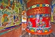 Image of Large colorful prayer wheel in Buddhist monastery.