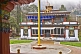 Image of Flagpole and frontage of a Buddhist monastery.