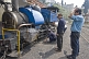 Image of Engineers try to repair one of the narrow gauge steam locomotives on the Darjeeling Hill Railway.