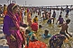 Image of Crowds of Hindu pilgrims bathe in Ganges river shallows on Basant Panchami Snana.