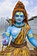 Image of Blue face and torso of clay statue of god Shiva at Kumbh Mela religious festival.
