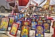 Image of Collection of framed religious Hindu paintings for sale at Kumbh Mela festival.