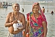 Image of Elderly Indian couple pose after taking their sacred dip in Ganges river.
