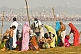 Image of Pilgrims on east bank of Ganges watch the mass crowds bathing on the west bank.