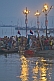 Image of Pilgrims bathe in crowded Ganges Yamuna River Sangam area before dawn.
