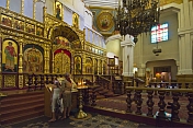 A mother and her daughter pray in the Zenkov Cathedral.