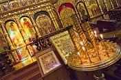 Candles and golden icon screen in the Zenkov Cathedral.