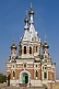 Image of Eastern Orthodox church with gilded onion domes.