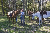 Riding instructor with horses in forest at the Estancia Los Potreros.