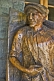 Image of Life-sized wood carving of old man outside of the Civic Centre.
