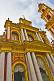 Image of Red and gold stucco frontage of the Basilica San Fransisco.