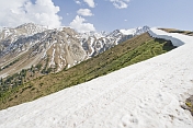 A well-defined snowline marks the Altyn Arashan Mountains in Sarycat Ertas Nature Reserve.