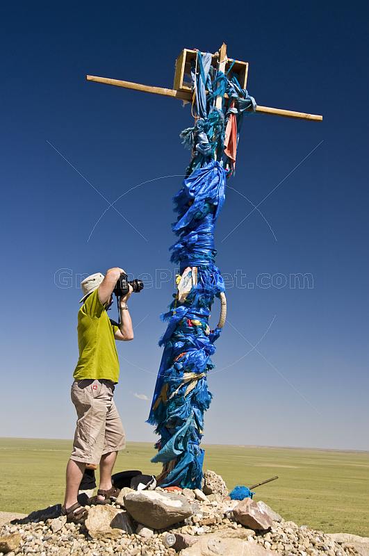 Photographing an 'Ovoo', a Mongolian Shamanistic cairn for travellers.