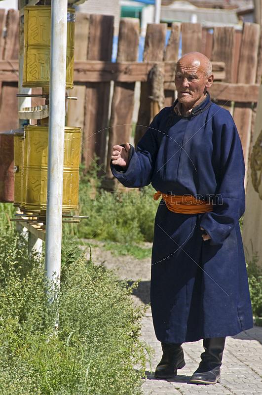 Old man with prayer wheels at the Gandan Muntsaglan Khiid monastery.